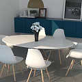 Modern White Round Dining Table With White Chairs Wooden Legs And Blue Cabinet Decorations