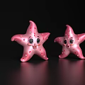 Two Adorable Pink Starfish Featuring White Spots And Smiling Faces On Black Shiny Surface