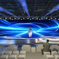 Modern Stage With Large Blue Illuminated Screen Circular Light Lines Podium White Seats And Audience
