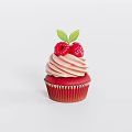 Red Paper Cupcake With Pink Swirled Frosting And Fresh Raspberries Topped With Green Leaf