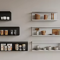 Stylish Kitchenware Display On Black And White Shelves With Bowls Mugs Jars And Plates
