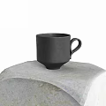 Black Ceramic Cup With Handle Placed On Textured Patterned Cloth Surface 3d model