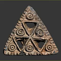 Triangular Carved Terracotta Artifact With Spiral Patterns And Hollow Decorative Design