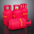 Red Indane Brand LPG Cylinders Standing And Lying On Black Surface