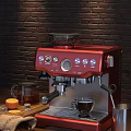 Red Coffee Machine With A Cup Of Coffee Coffee Beans Glass Pot And Brick Wall Background