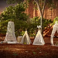 Scenic Camping Campsite with Various Tents String Lights Lush Trees and Red Rock Backdrop