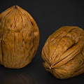 Two Fresh Whole Walnuts In Shell With Natural Brown Texture On Dark Background