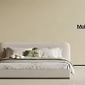 Modern Simple Children's Bed With White Headboard And Green White Pillows On Beige Wall