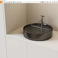 Modern Bathroom Round Black Washbasin With Silver Faucet And White Countertop