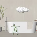 Modern White Bathtub with Cloud Shaped Pendant Light Green Side Table Hanging Towel and Plant