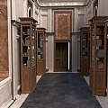 Classical Hallway Interior With Wooden Display Cabinets Decorative Walls Carved Ceiling And Dark Floor