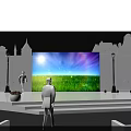 Blue Illuminated Stage Setup With Colorful Background Screen And Arranged Audience Seats
