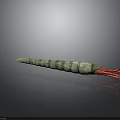 Green striped squid with long body and red tentacles on dark background