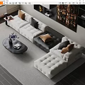 Modern Sectional Sofa With White Black Upholstery Brown Pillows And Coffee Table