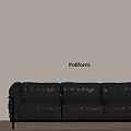 Black Three Seater Sofa With Metal Legs Against Poliform Light Colored Wall