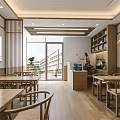 Spacious Open Restaurant Interior With Wooden Tables Chairs Pendant Lights Wall Decorations And TV