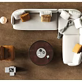 Modern White Sectional Sofa and Round Wooden Coffee Table Set with Pillows and Orange Chair