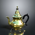 Elegant Golden Teapot With Black Handle And Decorative Top Design