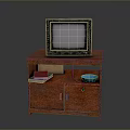 Vintage Old Computer Monitor On Wooden TV Stand With Blue Bowl And Books