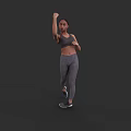 Fit Woman in Activewear Exercising with Boxing Fist and Tight Leggings