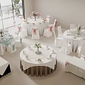 Multiple Round Dining Table Set with White Tablecloths Floral Centerpieces and Pink Ribbon Chair Covers