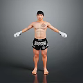 Shirtless Man With Chest Tattoo Wearing White Boxing Gloves And Everlast Shorts In Standing Pose