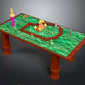Wooden Table With Green Tabletop And Colorful Models Pink Tower Yellow Castle And Green Figure