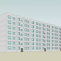 Modern Residential Apartment Building With Yellow And Gray Exterior Multiple Windows And Balconies