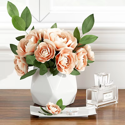 White Geometric Vase With Light Pink Flowers Green Leaves And Transparent Perfume Bottle On Table 3d model