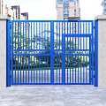 Blue Metal Gate With Railing Design And Concrete Pillars Against High Rise Buildings And Greenery