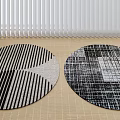 Round Rugs With Black And White Geometric Stripes And Textured Patterns On Light Wooden Floor