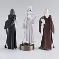 Fashion Mannequins Wearing Brown Beige Black Long Dresses With Unique Cuts And Poses On Stand