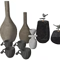 Elegant Ceramic Vessels Featuring Various Shaped Vases Decorative Mugs And Small Bird Ornaments