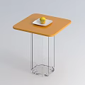 Sleek Coffee Table With Orange Tabletop Transparent Glass Legs And White Plate With Lemon