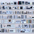 Stylish Bookshelves Filled With Various Books Magazines And Decorative Items