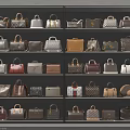Elegant Handbags Collection Displayed In Shelving Unit With Various Styles And Colors
