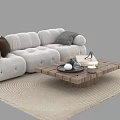 White Upholstered Sofa with Pillows and Wooden Coffee Table Set on Woven Rug