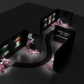 Photo Check In Spot With Black Display Walls Pink Flowers Curved Path And Picture Displays