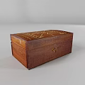 Decorative Wooden Box With Intricate Carved Patterns And Golden Accents