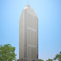 Modern High Rise Office Building With Glass Facade Against Blue Sky And Green Trees