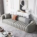Gray Large Sofa With Gold Trim And Decorative Pillows In Elegant Living Room