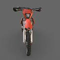 Orange and Black Motocross Motorcycle With Large Off Road Tires And White Seat