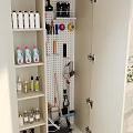 Organized Balcony Cabinet with Shelves for Cleaning Supplies and Pegboard Tools
