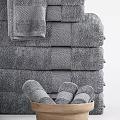 Gray Textured Cotton Towels Stacked With Hand And Bath Sizes And Wooden Bowl