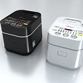 Two Black and White Midea Rice Cookers as Modern Kitchen Appliances with Digital Control Panels
