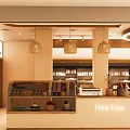 Modern Dessert Shop Interior With Circular Lighting Display Counter And Fresh Pastries