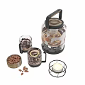 Refreshing Lemon Tea in Glass Teapot with Glass Cups Almonds and Candle