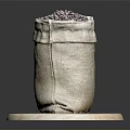 Burlap Bag Filled With Coffee Beans On Round Wooden Disc