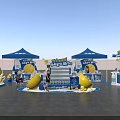 Professional Commercial Equipment with Blue Tent Style Booths Yellow Decorations and Display Stands