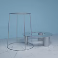 Circular Silver Display Shelves Two Tall And Short On Light Blue Background With Marble Floor